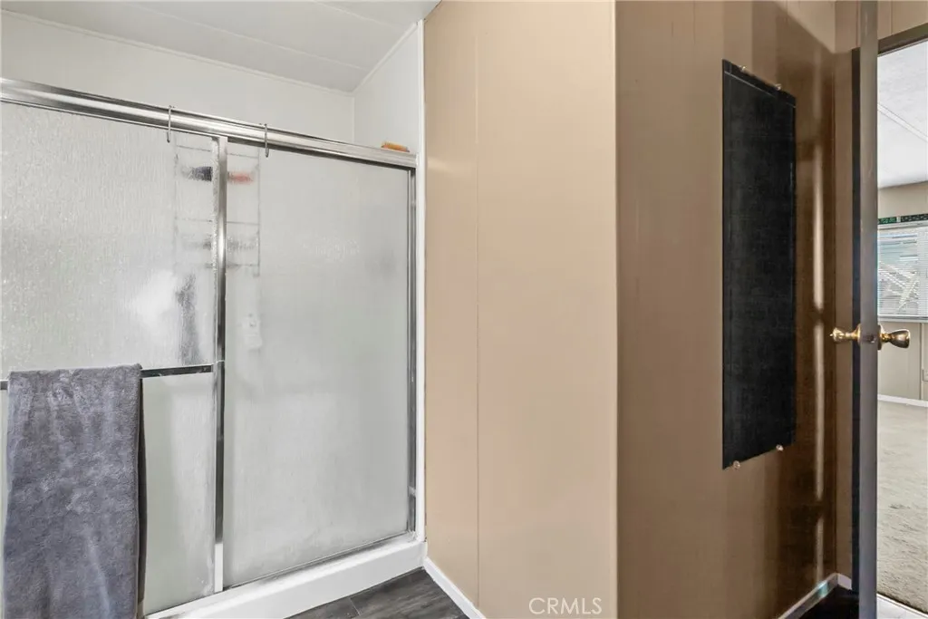 519 West Taylor Street, Unit 252 Santa Maria, CA 93458 - Photo 15 of 52 a bathroom with a glass shower door