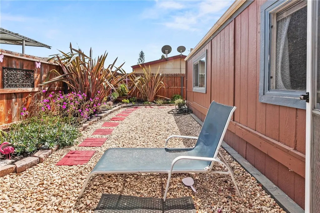 519 West Taylor Street, Unit 252 Santa Maria, CA 93458 - Photo 24 of 52 a view of a chairs and tables in the back yard of the house