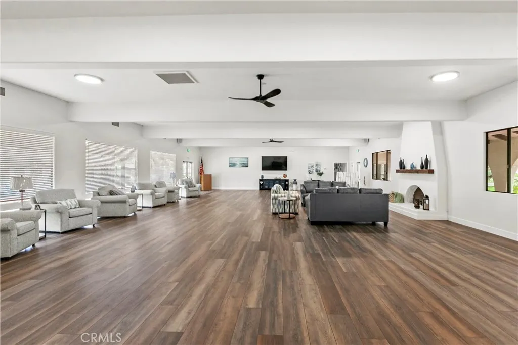 519 West Taylor Street, Unit 252 Santa Maria, CA 93458 - Photo 30 of 52 a living room with furniture and a wooden floor