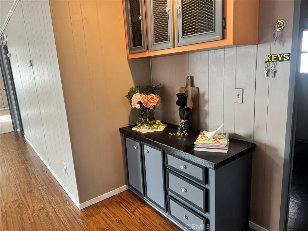 519 West Taylor Street, Unit 252 Santa Maria, CA 93458 - Photo 49 of 52 a view of a hallway with wooden floor and stairs