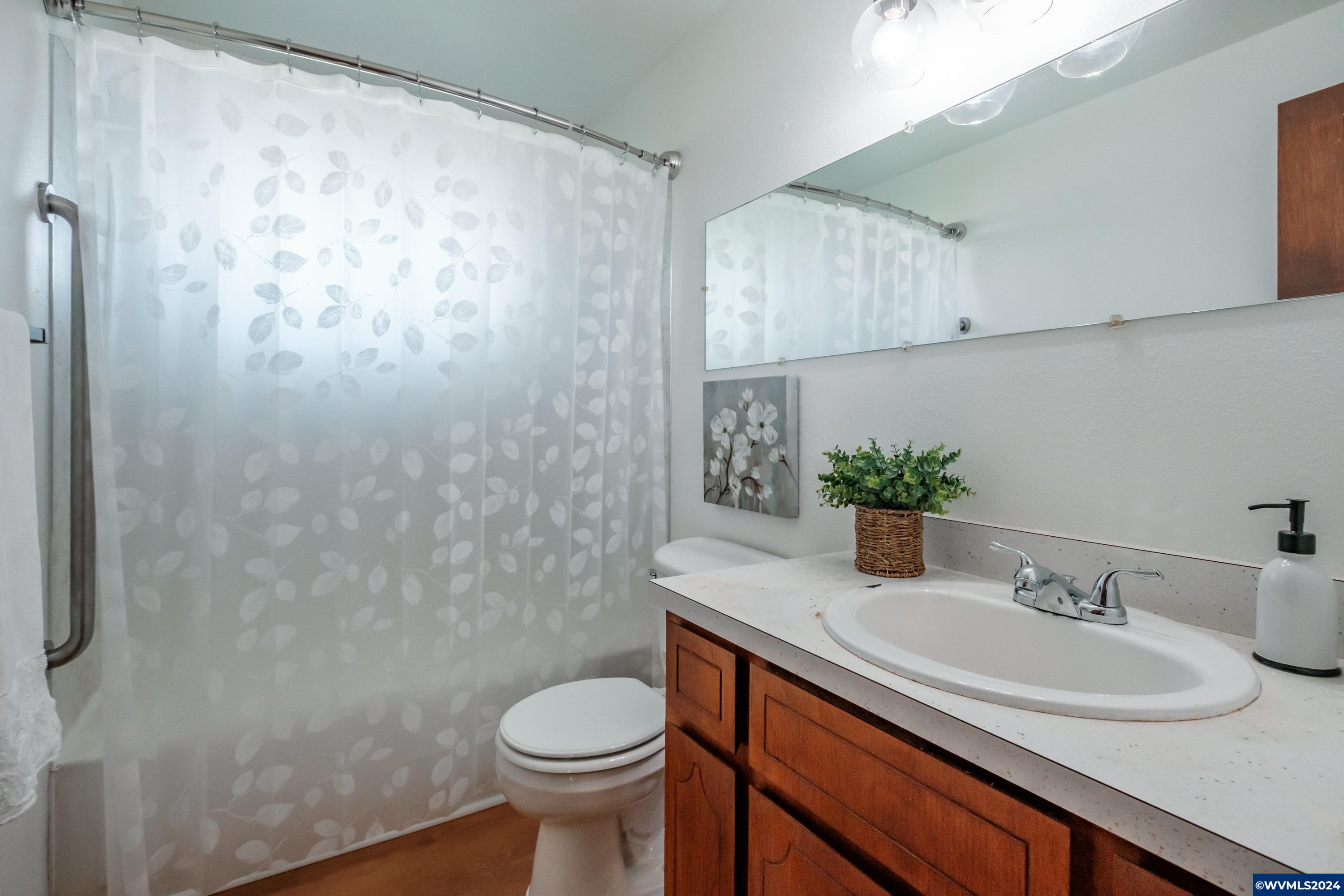 2550 Perrydale Road Dallas, OR 97338 - Photo 16 of 39 a bathroom with a sink toilet and shower