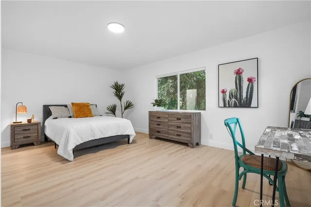 a bedroom with a bed and furniture