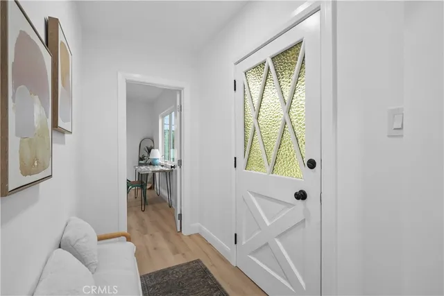 a view of hallway with livingroom and furniture