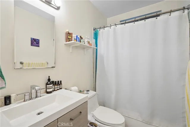 a view of a livingroom with workspace and a window