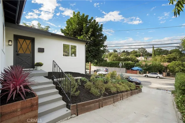 an aerial view of a house with outdoor space