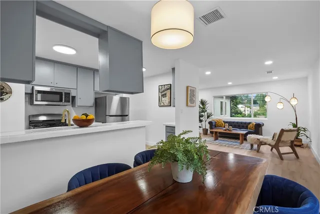 a view of kitchen and dining room with wooden floor