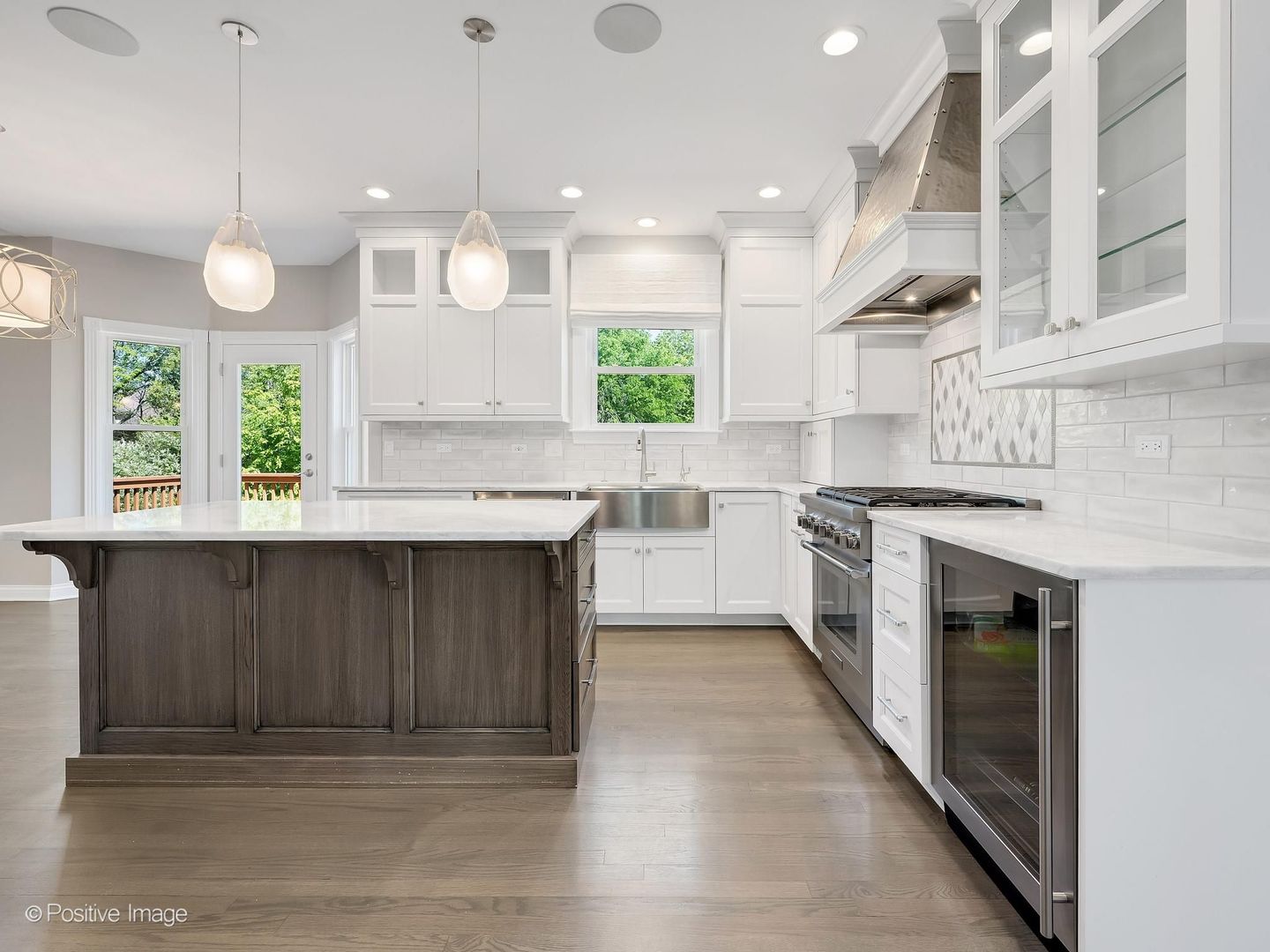 832 Bemis Road Glen Ellyn, IL 60137 - Photo 18 of 62 a kitchen with a stove a sink and a window