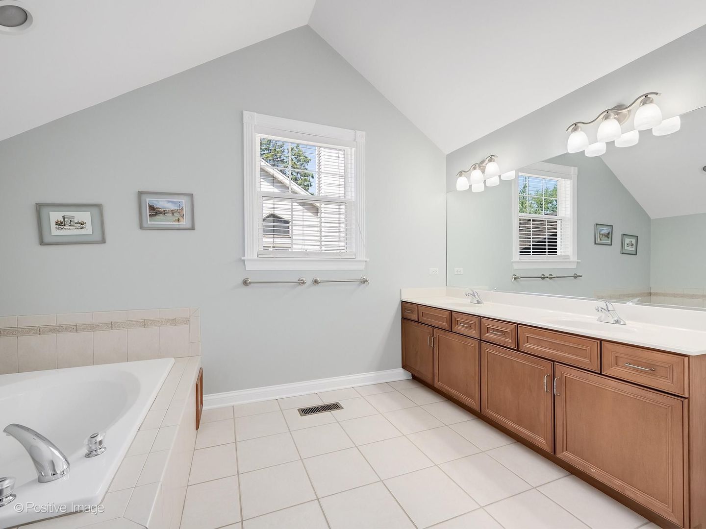 832 Bemis Road Glen Ellyn, IL 60137 - Photo 33 of 62 a bathroom with a tub sink and mirror