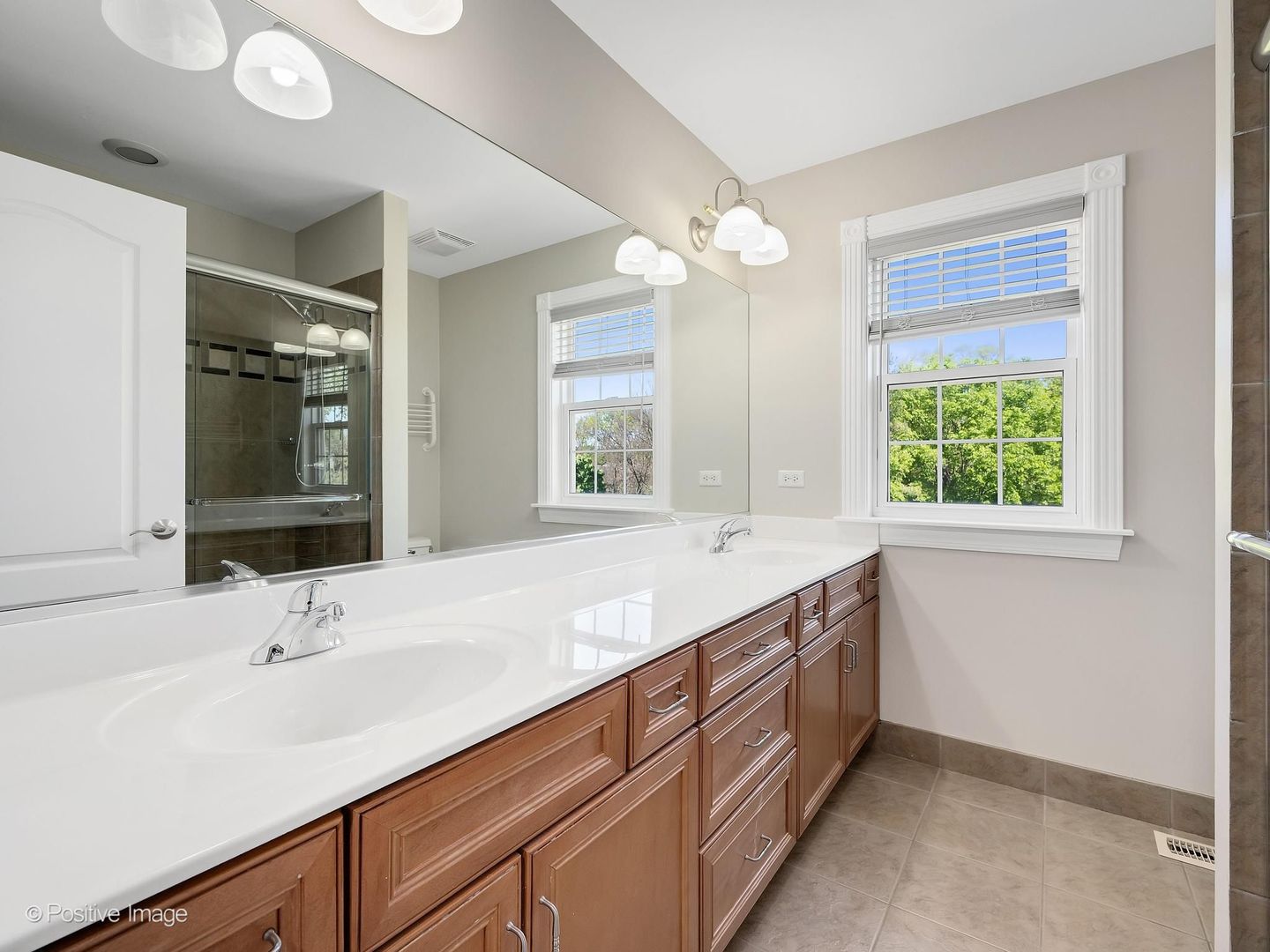 832 Bemis Road Glen Ellyn, IL 60137 - Photo 38 of 62 a bathroom with a sink and a mirror