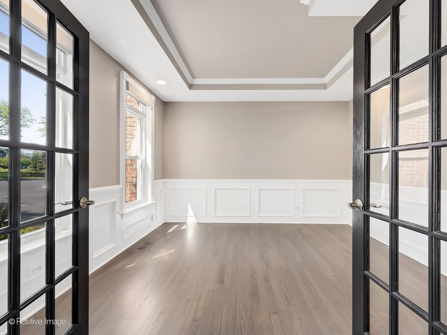832 Bemis Road Glen Ellyn, IL 60137 - Photo 4 of 62 a view of an empty room with wooden floor and a window