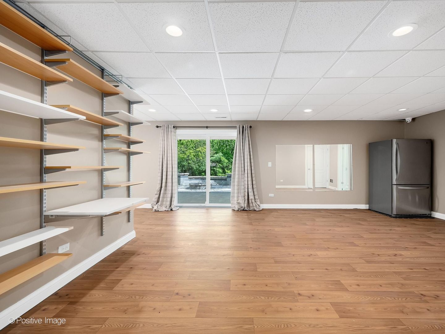 832 Bemis Road Glen Ellyn, IL 60137 - Photo 45 of 62 a view of an empty room with a window and wooden floor