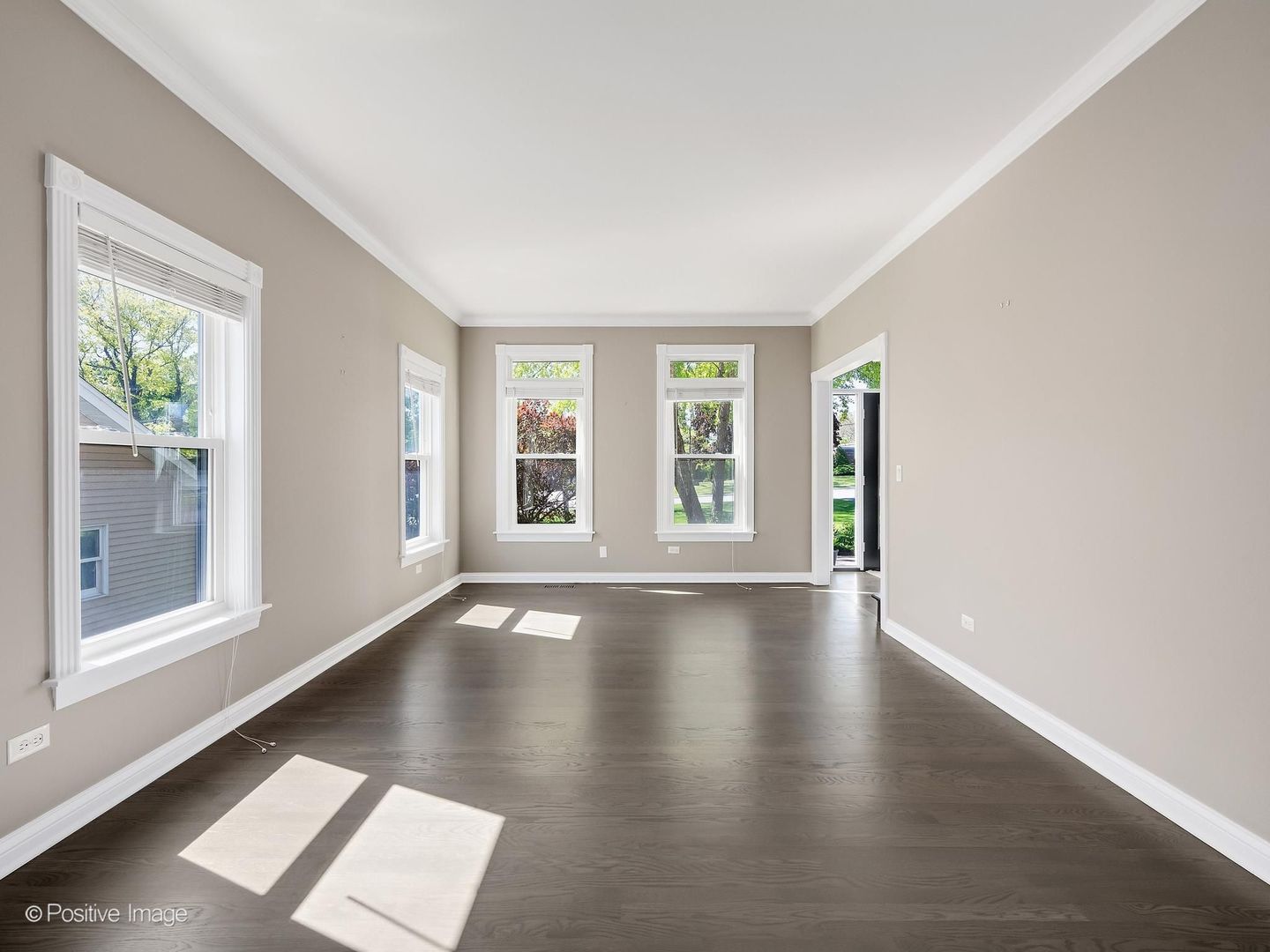 832 Bemis Road Glen Ellyn, IL 60137 - Photo 8 of 62 a view of an empty room with wooden floor and a window
