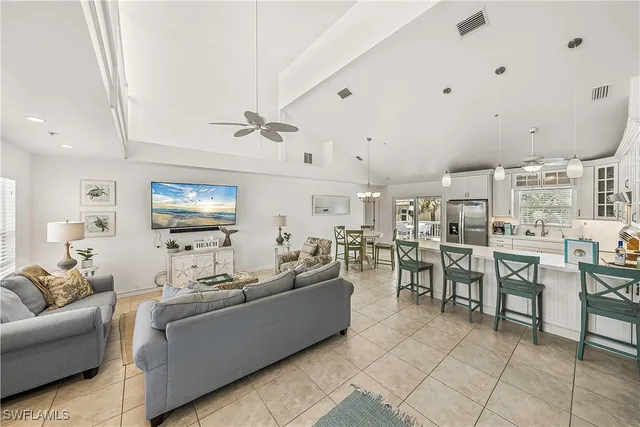 a living room with lots of furniture and a flat screen tv