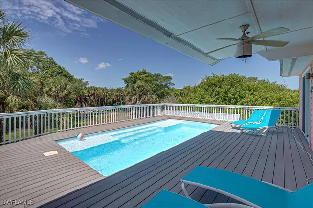 a view of deck with a table and chairs with wooden floor