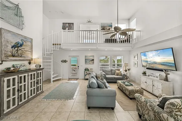 a living room with lots of furniture and a flat screen tv