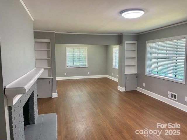 3217 Celanese Road Rock Hill, SC 29732 - Photo 3 of 7 an empty room with wooden floor and windows