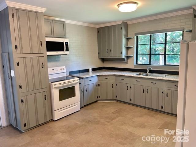 3217 Celanese Road Rock Hill, SC 29732 - Photo 4 of 7 a kitchen with a stove white cabinets and a sink