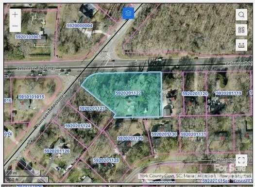 a small white building with a view of swimming pool