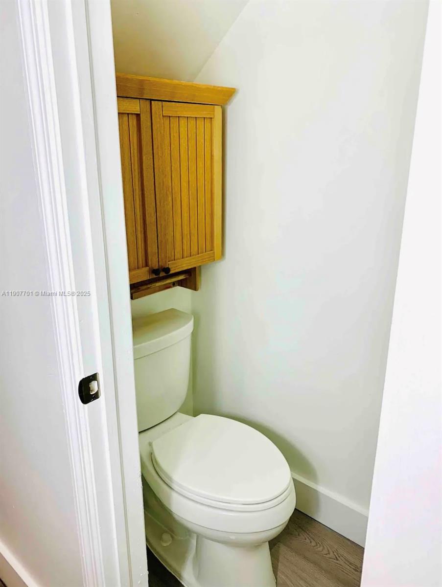 821 Southwest 2nd Street, Unit 6 Miami, FL 33130 - Photo 12 of 15 a bathroom with a sink and toilet