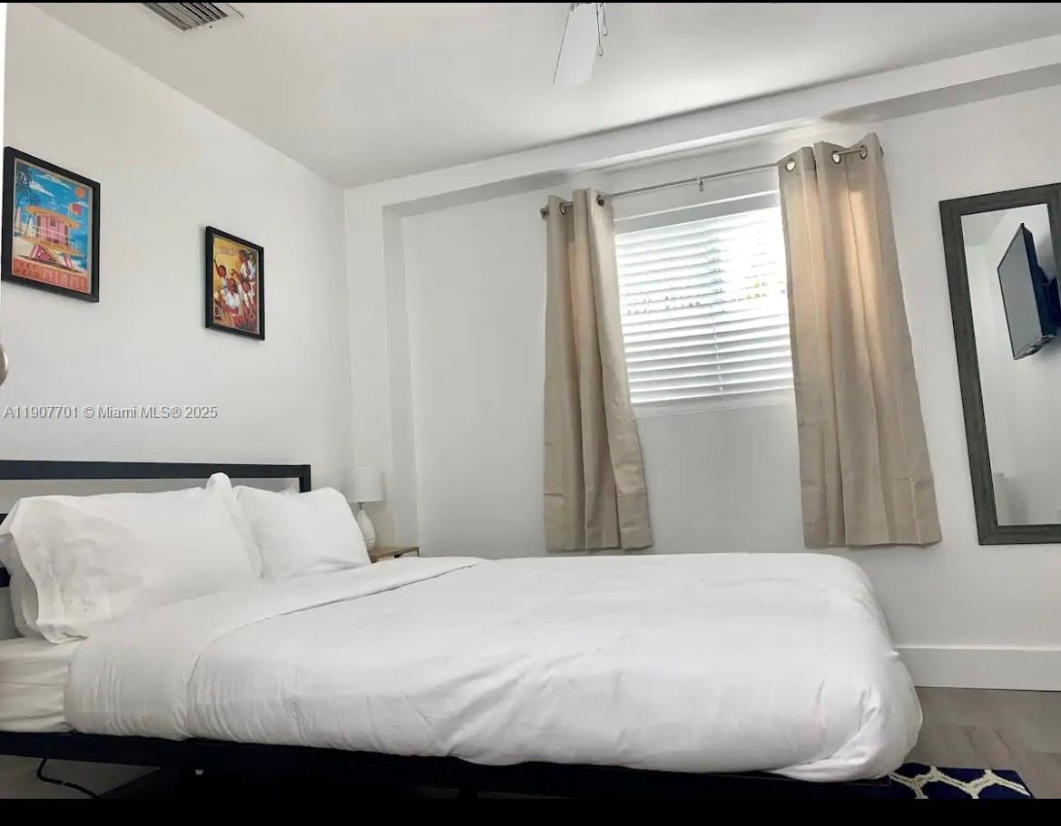 821 Southwest 2nd Street, Unit 6 Miami, FL 33130 - Photo 15 of 15 a bedroom with a bed and a window