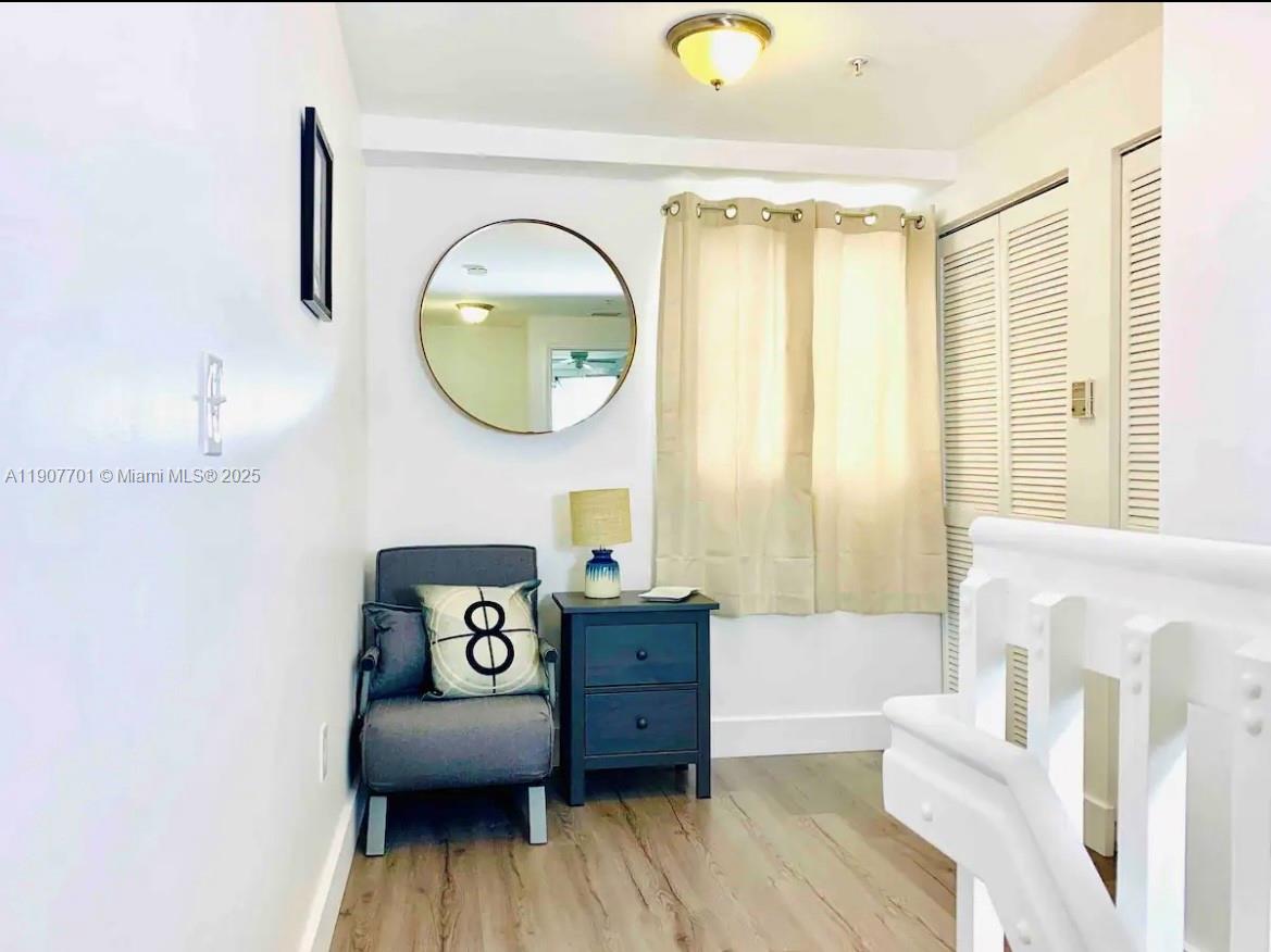 821 Southwest 2nd Street, Unit 6 Miami, FL 33130 - Photo 7 of 15 a view of wooden floor and bathroom