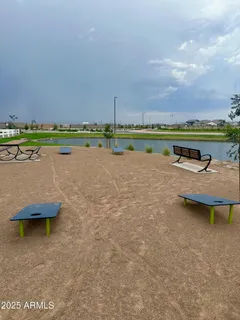 an aerial view of a house with outdoor space and lake view