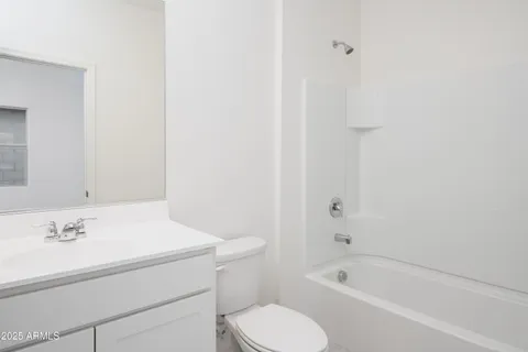a bathroom with a sink toilet and bathtub