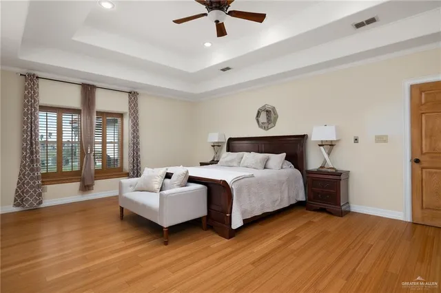 a bathroom with a double vanity sink a mirror a bathtub and shower