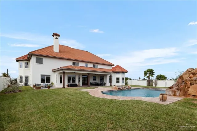 a view of a swimming pool with an ocean view