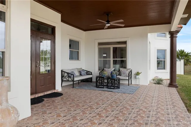 a view of house with yard and sitting area