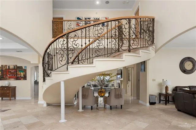 a view of a dining room with furniture and chandelier