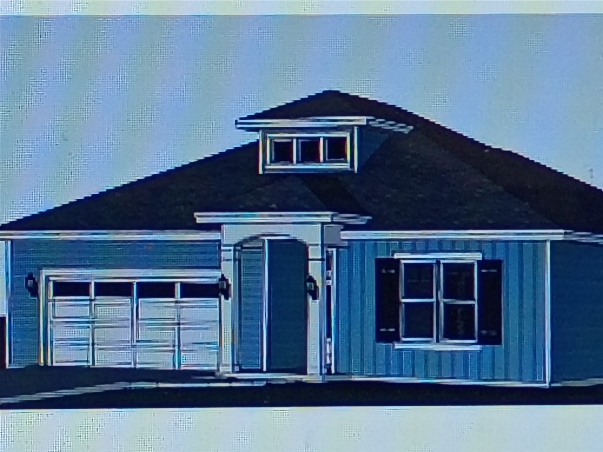 307 Division Street Amelia Island, FL 32034 - Photo 2 of 2 a front view of a house with a garage