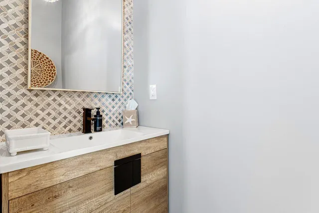 a bathroom with a sink and a mirror