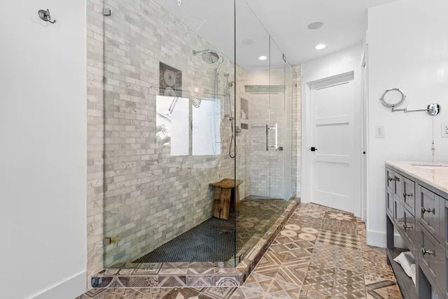 a bathroom with a sink and shower