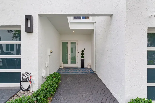 a view of a hallway with paintings on the wall