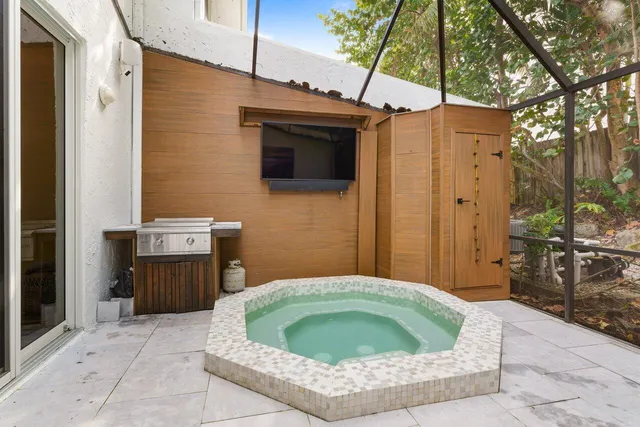 a bathroom with a shower and a sink