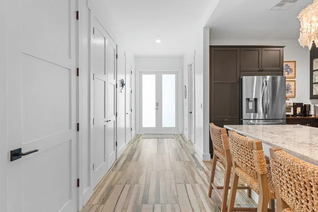 a view of a bathroom with a tub shower and mirror