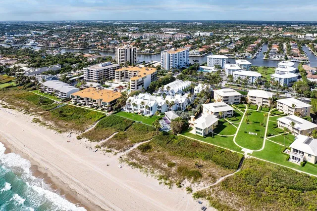 a view of an ocean with a building in the background