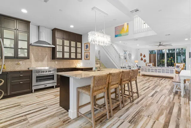 a kitchen with stainless steel appliances granite countertop a stove and cabinets