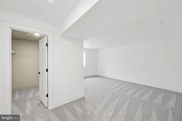 a view of a livingroom with furniture and staircase