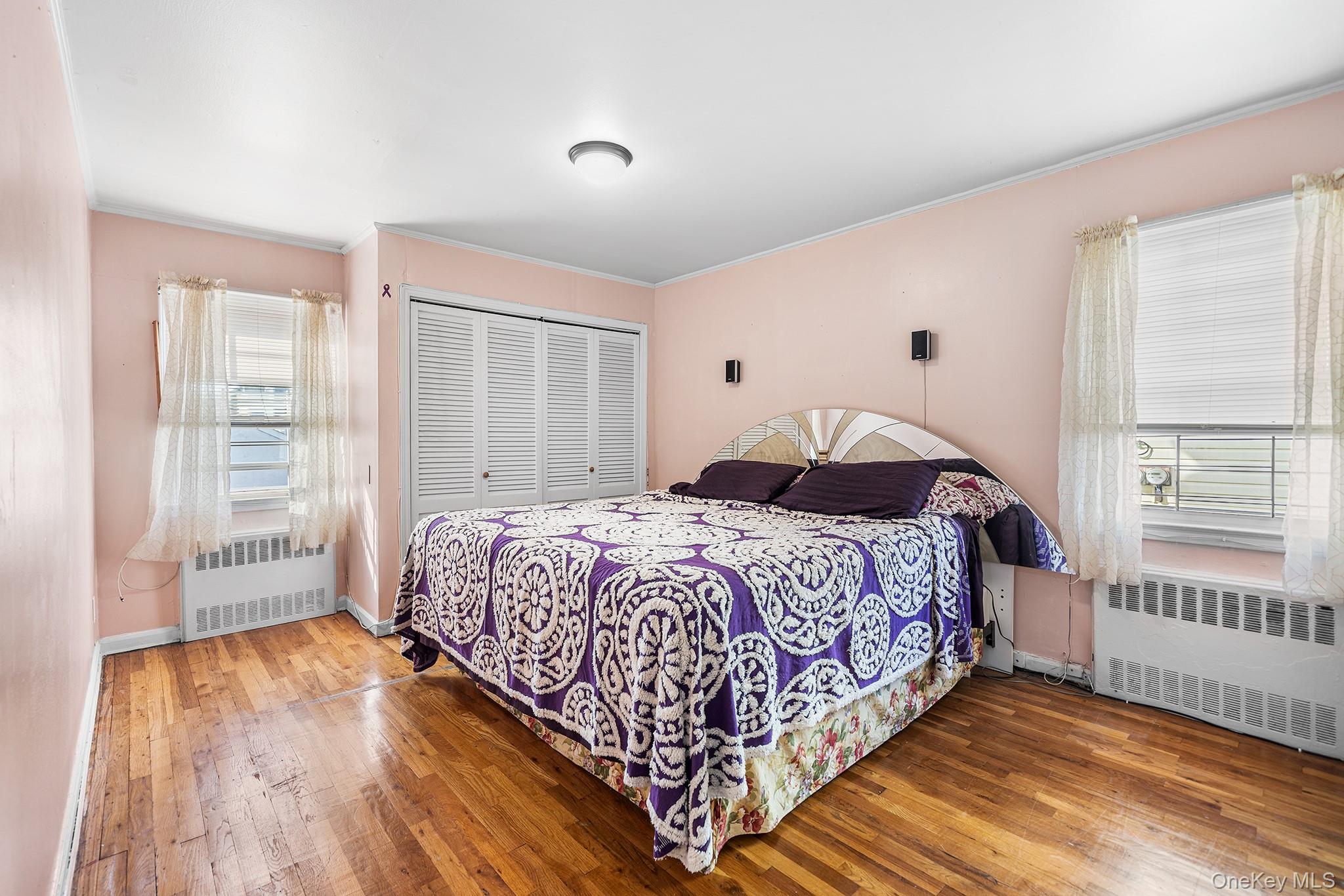 27-11 Deerfield Road Queens, NY 11691 - Photo 15 of 43 a bedroom with a bed and a window