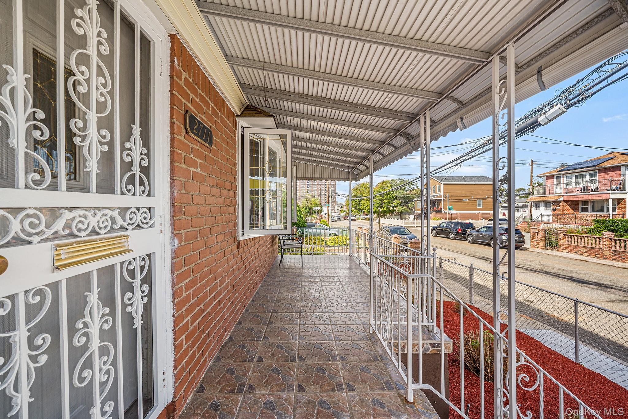 27-11 Deerfield Road Queens, NY 11691 - Photo 4 of 43 a view of a patio with wooden floor