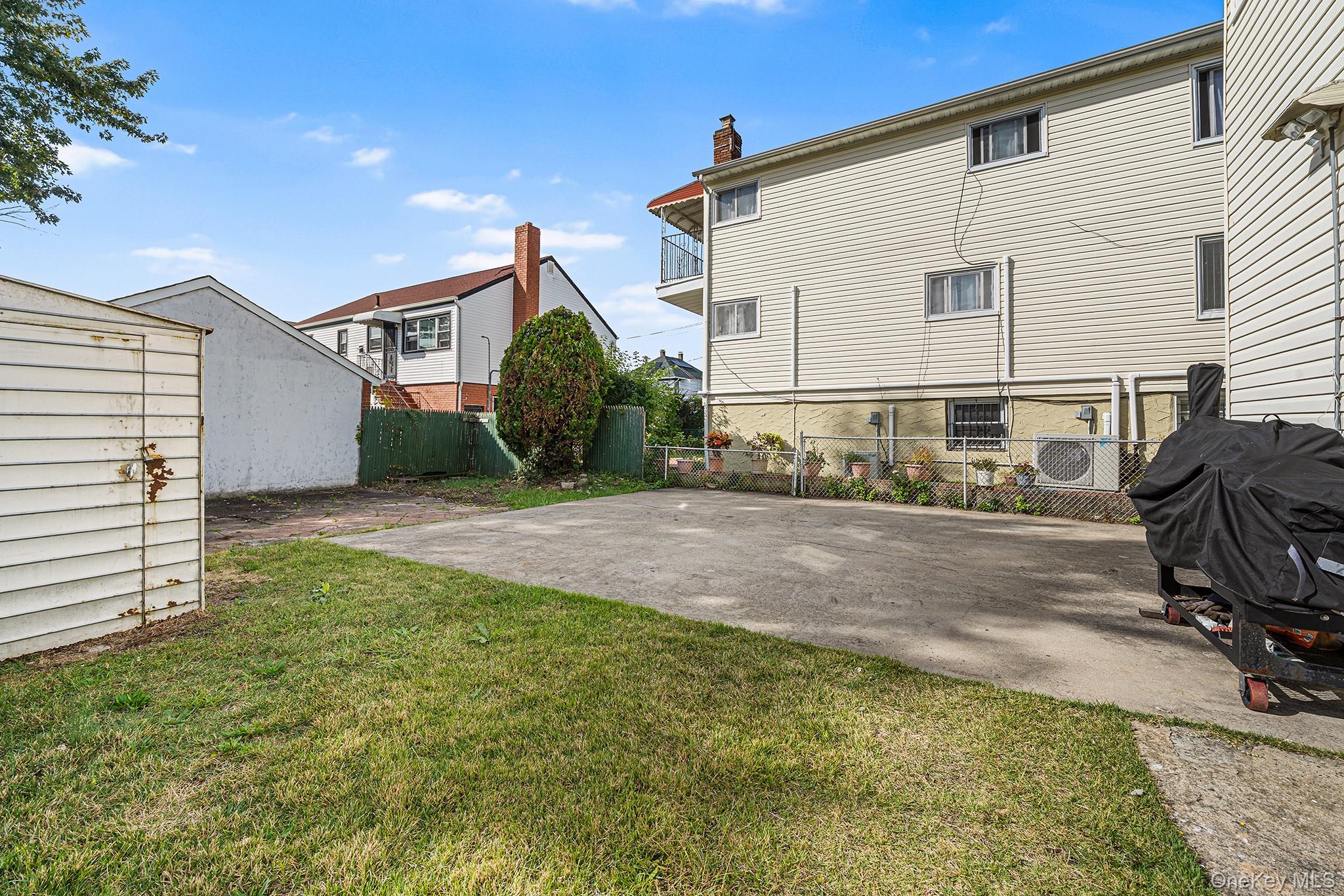 27-11 Deerfield Road Queens, NY 11691 - Photo 42 of 43 a view of backyard of house