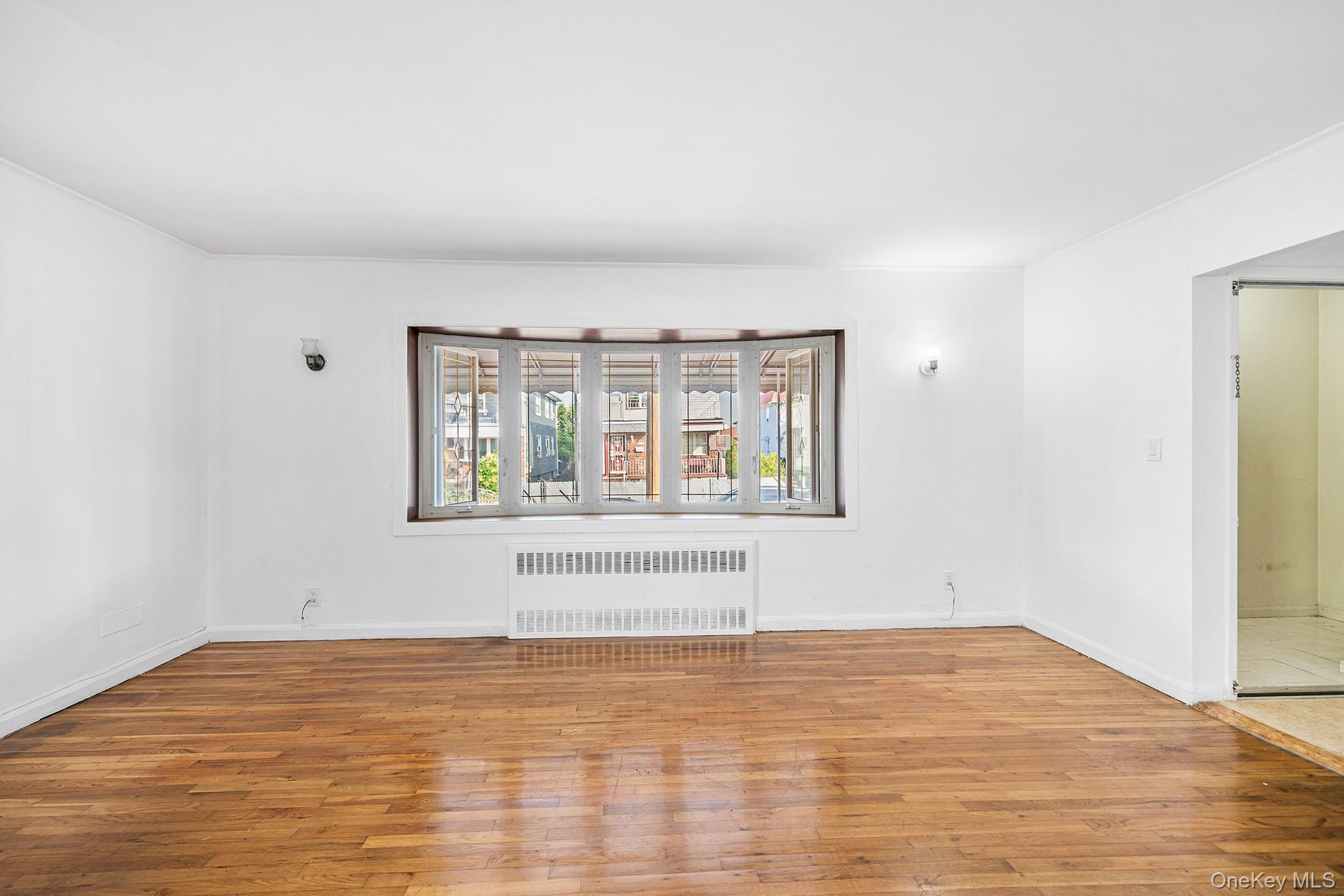 27-11 Deerfield Road Queens, NY 11691 - Photo 8 of 43 a view of an empty room with window