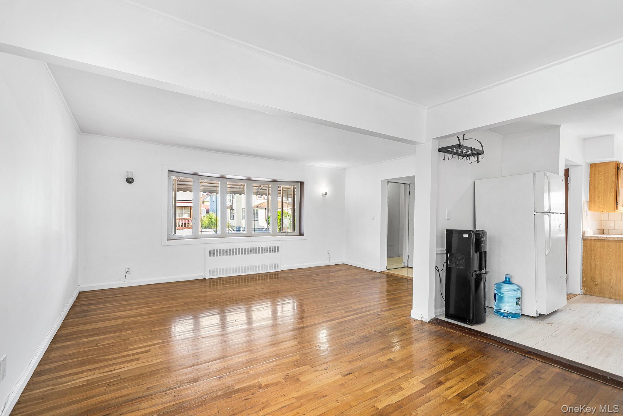 27-11 Deerfield Road Queens, NY 11691 - Photo 10 of 43 a view of an empty room with closet and a window