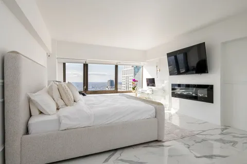 a view of living room with furniture and flat screen tv