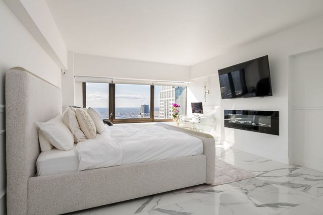 a view of living room with furniture and flat screen tv