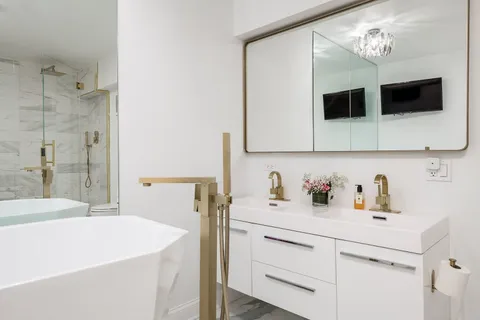 a bathroom with a shower and a sink