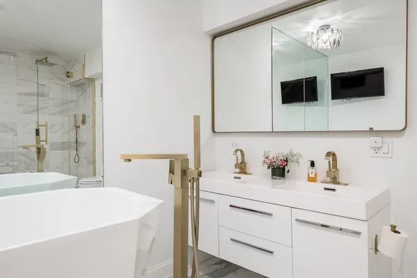 a bathroom with a shower and a sink