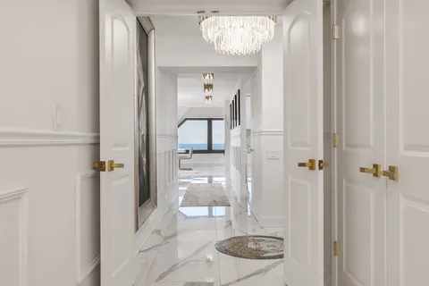 a view of a hallway with washer and dryer
